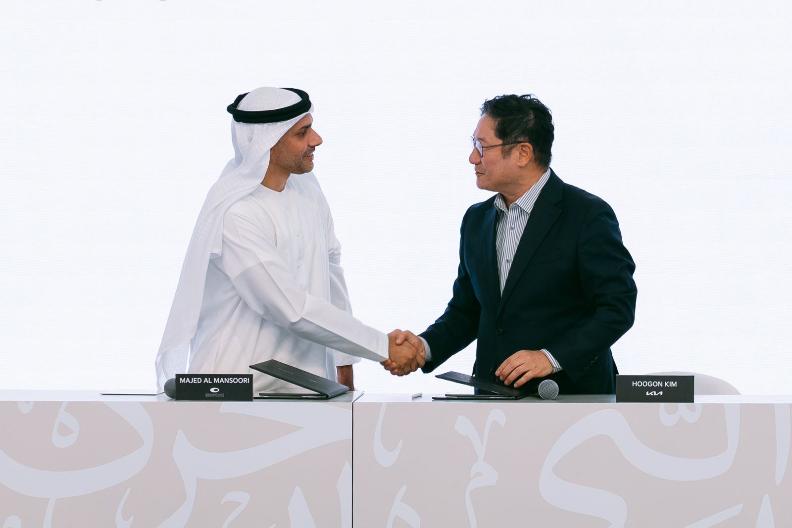 Hoogon Kim and Majed Al Mansoori at the Kia × Museum of the Future partnership signing